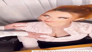 Fabulous stunner with crimson hair, Amour is toying with her hefty bosoms in front of the camera