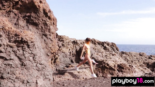 Naked Spanish babe posing on the rocks