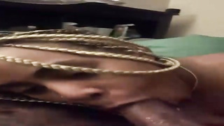 Ebony honey with ash-blonde hair is impatiently blowing a good-sized, black man rod as deep as she can