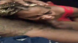 Ebony honey with ash-blonde hair is impatiently blowing a good-sized, black man rod as deep as she can