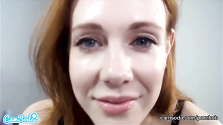 Crimson haired dame, Maitland Ward is pridefully demonstrating her immense breasts in front of the camera