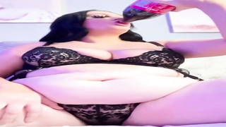 Humungous female with immense bosoms is dressed in softcore, black undergarments while pawing herself on webcam