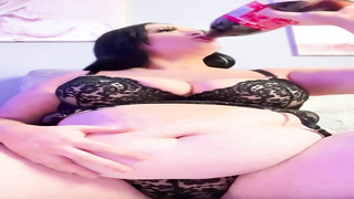 Humungous female with immense bosoms is dressed in softcore, black undergarments while pawing herself on webcam