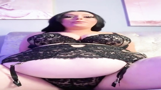 Humungous female with immense bosoms is dressed in softcore, black undergarments while pawing herself on webcam