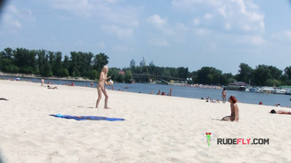 Adorable nudist teen sunbathes nude