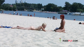 Adorable nudist teen sunbathes nude