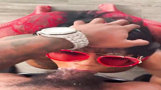 Kinky Ebony dark-haired is throating in front of the camera, while getting down on all fours on the floor