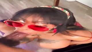 Kinky Ebony dark-haired is throating in front of the camera, while getting down on all fours on the floor