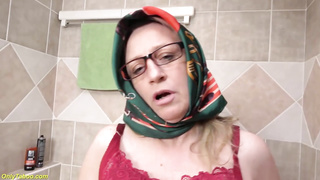 Wild grandmother is frolicking her vulva and arse in the shower and bellowing while nutting