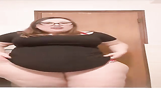 Good-Sized bi-atch is posing in front of the camera, while dressed in nothing but glamour undergarments