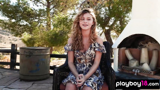 Big boobed nude blondie posed on a horse