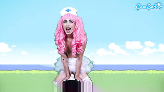 Pinkish haired nurse, Delilah Day is railing a Sybian Saddle and squealing from sheer pleasure while spunking