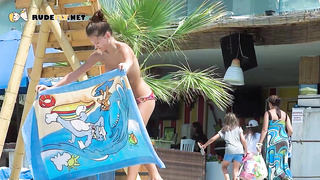 Energetic young nudist girls have fun outdoors