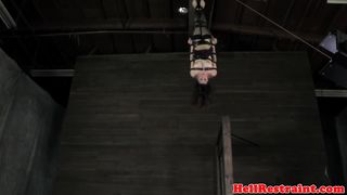 Dark haired lovely teenage damsel gets dangled in the air and caned by her masculine partner