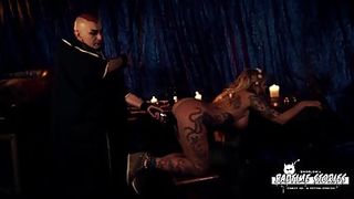 Ball-Gagged, inked platinum-blonde is being vibed from the back and squealing from enjoyment while nutting