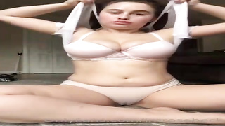 Round black-haired with immense boobies is delicately jacking in front of the camera, because it perceives excellent