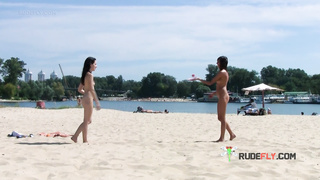 Petite nudist teen enjoys a beautiful day at the beach