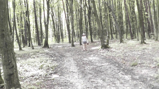Upskirt no undies . Bare mother Cougar sans undies picks mushrooms in woods . Outdoors Outside