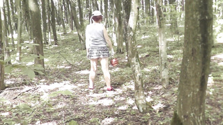 Upskirt no undies . Bare mother Cougar sans undies picks mushrooms in woods . Outdoors Outside