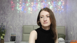 Brunette amateur with naked shoulders on webcam