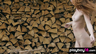 Redhead Russian naked babe chopping wood