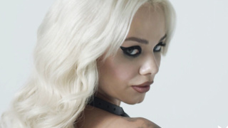 Petite blonde teen posing with the sword