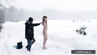 Naked barefoot Greta tied up in the snow