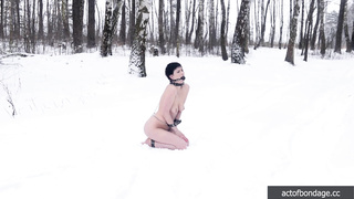 Naked barefoot Claudia chained in the snow