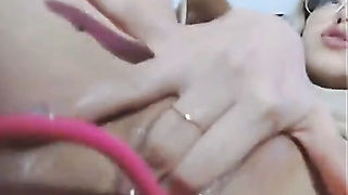 Petite Chick with glasses masturbates