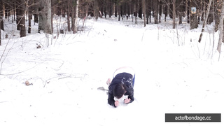 Barefoot Claudia is captured in the cold winter forest