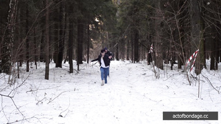 Barefoot Claudia is captured in the cold winter forest