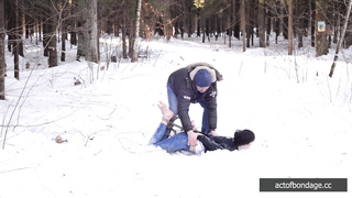 Barefoot Claudia is captured in the cold winter forest