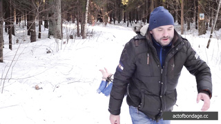 Barefoot Claudia is captured in the cold winter forest