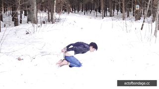 Barefoot Claudia is captured in the cold winter forest