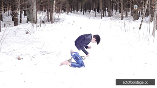 Barefoot Claudia is captured in the cold winter forest