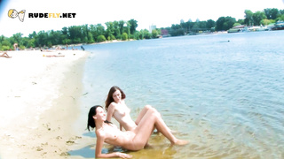 Preatty young nudist chicks have fun at the beach