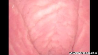 Corded up Japanese sweety gets played by the camera fake penis