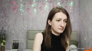 Brunette babe strips to bra on webcam solo show