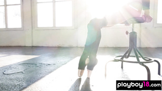 Flexible naked red ballerina practicing