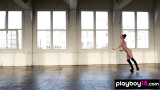 Flexible naked red ballerina practicing