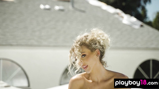 Naked blondie shows her pierced nipples