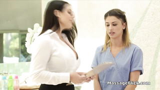 Oily masseuse scissoring with her curvy boss