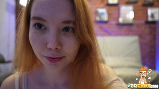 Horny redhead teen fingering pussy