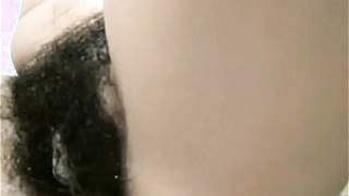 Arab mom Zina rubs extreme hairy cunt