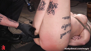 Tattooed bound slave fucked ith dildo on a stick