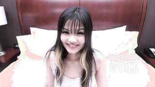 This VERY petite Asian teen is making her first porn
