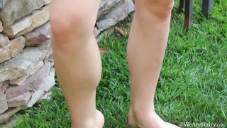 Brief-haired chick showcasing her fluffy honeypot outdoors