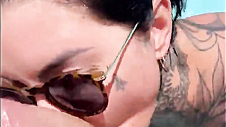 Tattooed british MILF pool blowjob