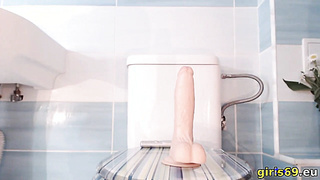Riding a dildo in the bathroom