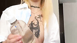 Naughty Tattoed Babe squirts on the floor